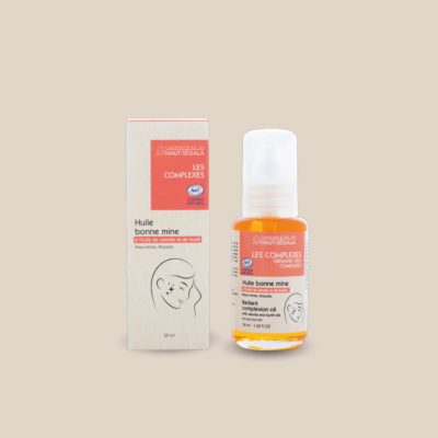 Photo produit : Huile bonne mine du Laboratoire du Haut-Séguala, présentée dans un flacon transparent à pompe avec bouchon et une boîte recyclée, 100 ml.