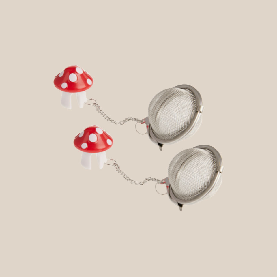 Two mushroom-shaped tea infusers